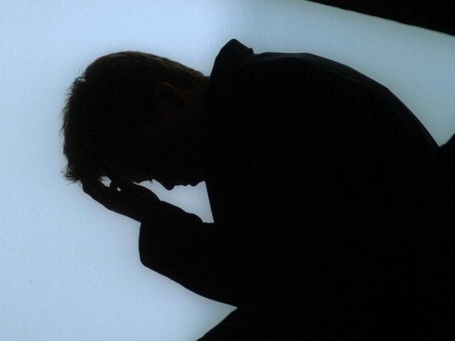 # BEFORE REUSE OF THIS IMAGE CHECK CONTENT AND COPYRIGHT ISSUES WITH THE /PICTURE /DESK- 03 Jul 2001  Young man, youth with his head in his hands suffering depression, suicide threat. mental illness. silhouette sad unhappy stress generic