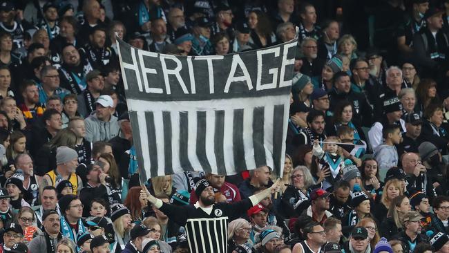 ADELAIDE, AUSTRALIA - MAY 08: A port fan holds up a prison bar sign in the crowd during the 2021 AFL Round 08 match between the Port Adelaide Power and the Adelaide Crows at Adelaide Oval on May 08, 2021 in Adelaide, Australia. (Photo by Sarah Reed/AFL Photos via Getty Images)