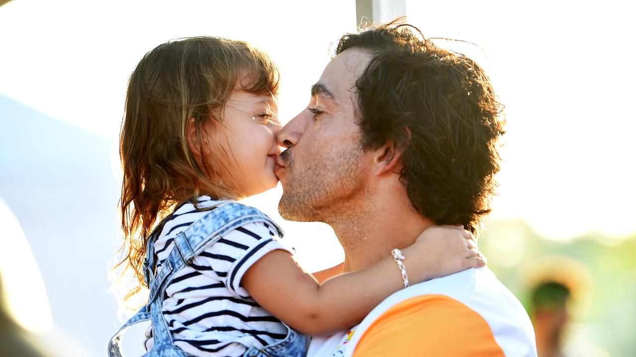 Johnathan Thurston as a baton bearer with his daughter Charlie during the Commonwealth Games 2018 Queens Baton Relay (QBR) in Townsville. Picture: Alix Sweeney, March 2018