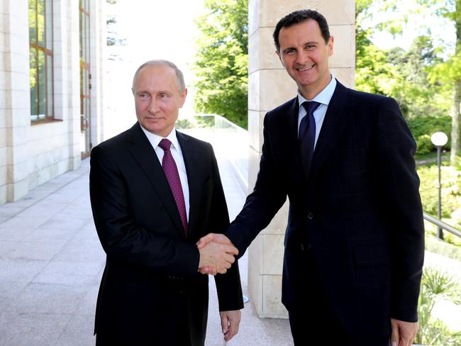 Russian President Vladimir Putin shakes hands with his Syrian counterpart Bashar al-Assad during their meeting in Sochi on May 17, 2018. Picture: AFP