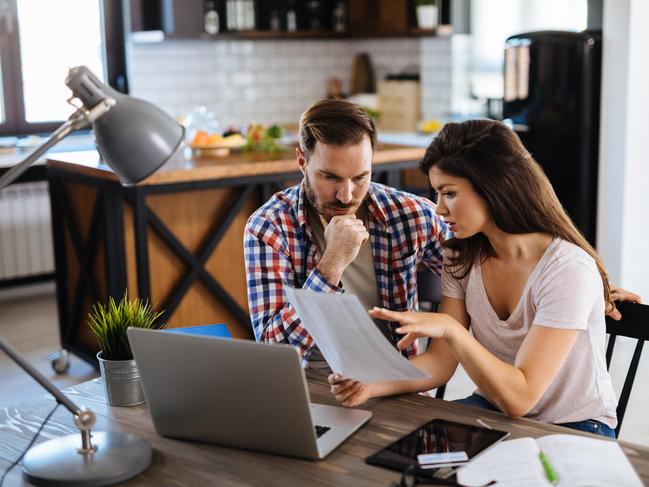 A couple discussing their bills including their mortgage. Picture: iStock.