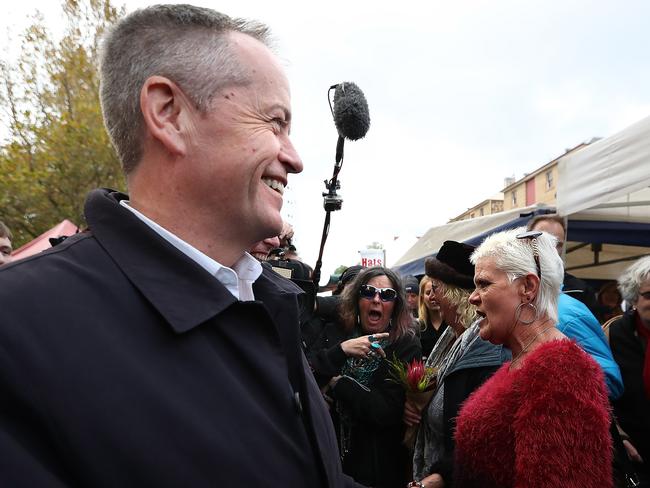 Opposition Leader Bill Shorten talking to Sandi Fitzgerald who mistook him for PM Scott Morrison while walking through Salamanca Markets in Hobart, Tasmania. Picture Kym Smith