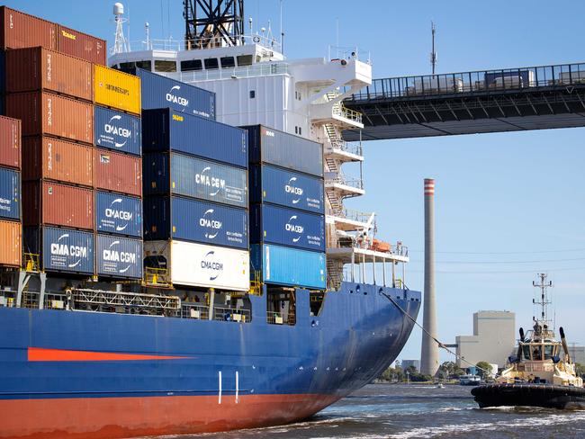 MELBOURNE, DECEMBER 9, 2022: Tour of AustraliaÃs largest container and general cargo port, the Port of Melbourne. A Svitzer tug boat follows a container ship under the West Gate Bridge. Picture: Mark Stewart