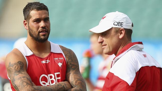 Lance Franklin speaks with John Longmire at a Swans training session.
