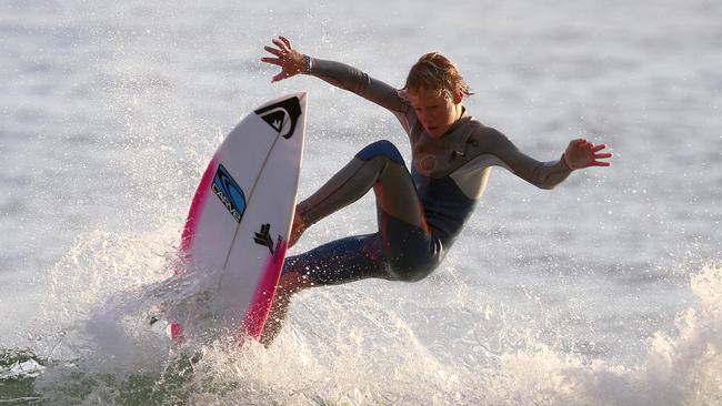 Finn Askew, at age 13, surfing near his home at South West Rocks on the NSW mid north coast. Pic Nathan Edwards