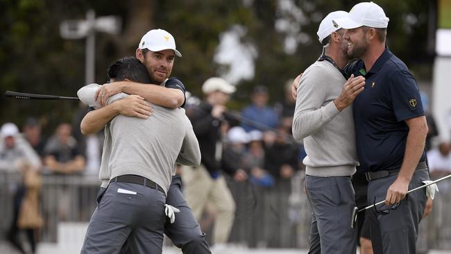 The Internationals celebrate on the 18th hole. Picture: AP