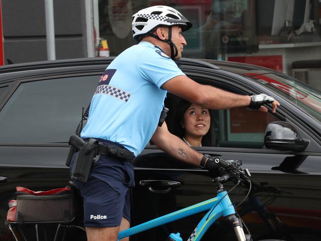 Senior Constable Ferdi Cokelek watched this woman on her phone for more than five seconds. Picture: David Crosling