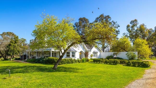 The homestead features four bedrooms, two bathrooms a sunlit central atrium and a music room.