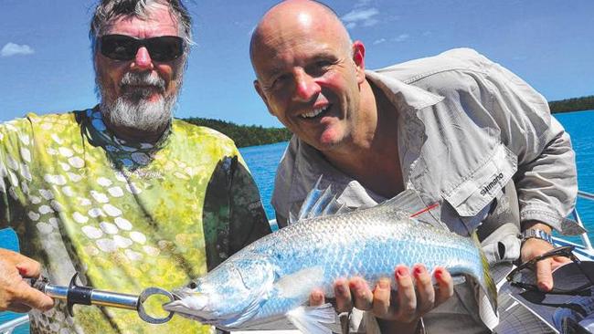 Now what are these two blokes up to? Bill Sawynok from Infofish on the left is fishing with Crownbet’s Brad Fanning, and is about to release a very-important silver barra