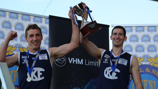 Kerang coach Troy Coates, left, and captain Josh Nitschke lift the Central Murray premiership cup.