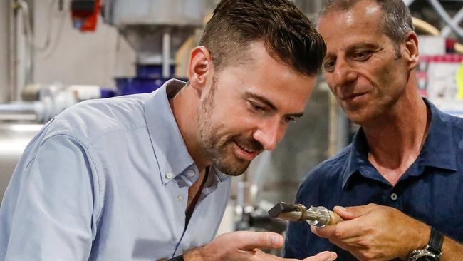 Liberal leader Zak Kirkup, left, with Peter Barile, owner of Brew Coffee Roasters in Wangara in Perth’s northern suburbs. Picture: Colin Murty