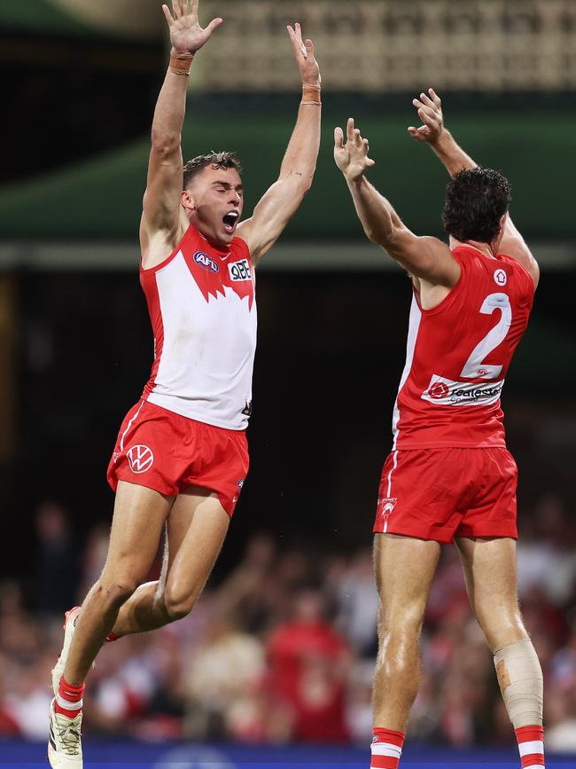 Will Hayward celebrates with Hayden McLean after the Swans edged towards a remarkable victory in Sydney. Picture: Matt King/AFL Photos/via Getty Images.