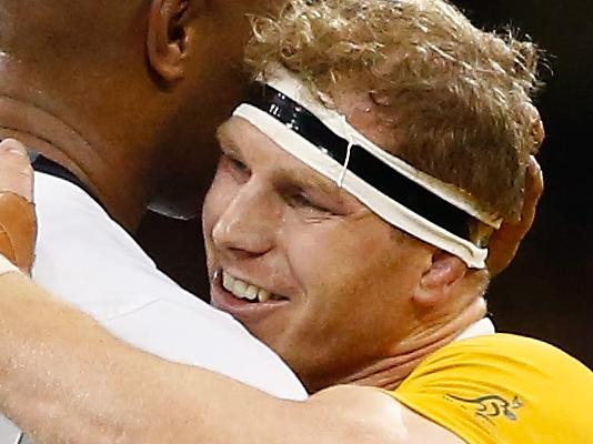 CARDIFF, WALES - SEPTEMBER 23: David Pocock of Australia embraces Nemani Nadolo of Fiji after the 2015 Rugby World Cup Pool A match between Australia and Fiji at the Millennium Stadium on September 23, 2015 in Cardiff, United Kingdom. (Photo by Stu Forster/Getty Images)