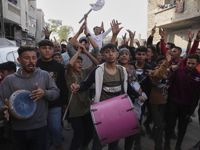 Palestinians chant slogans during an anti-war protest and against Hamas in a rare show of public anger against the militant group that rules the territory, in Beit Lahiya, northern Gaza Strip, Wednesday, March 26, 2025. (AP Photo/Jehad Alshrafi)