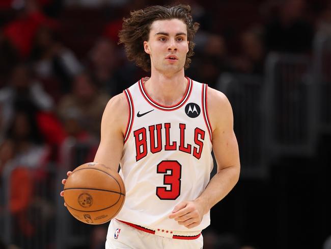 CHICAGO, ILLINOIS - OCTOBER 16: Josh Giddey #3 of the Chicago Bulls dribbles up the court against the Minnesota Timberwolves during the first half of a preseason game at the United Center on October 16, 2024 in Chicago, Illinois. NOTE TO USER: User expressly acknowledges and agrees that, by downloading and or using this photograph, User is consenting to the terms and conditions of the Getty Images License Agreement.  (Photo by Michael Reaves/Getty Images)