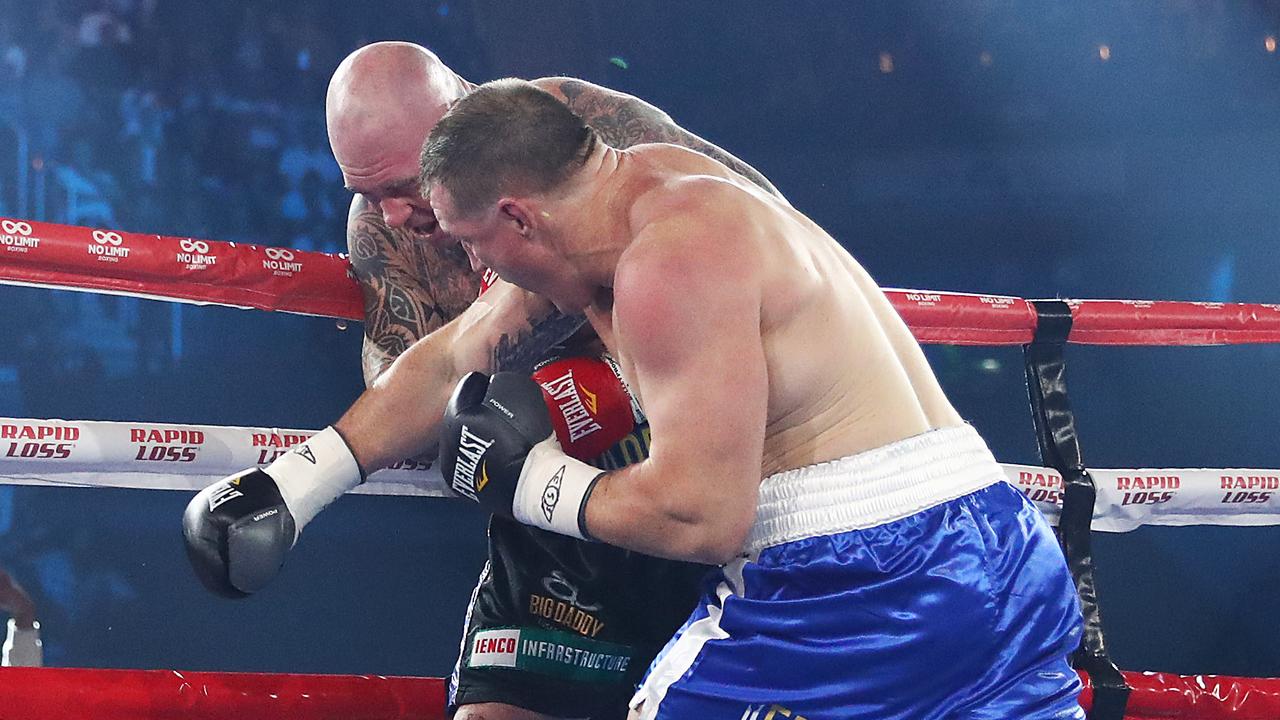 Paul Gallen punches Lucas Browne during their bout at WIN Entertainment Centre.