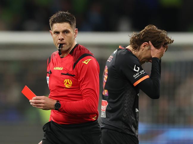 A shattered Max Burgess (right) leaves the field after being sent off by referee Shaun Evans. Picture: Robert Cianflone/Getty Images