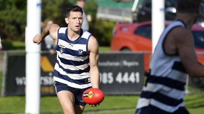 Mathew Dussin handballs. Picture: Andrew Batsch