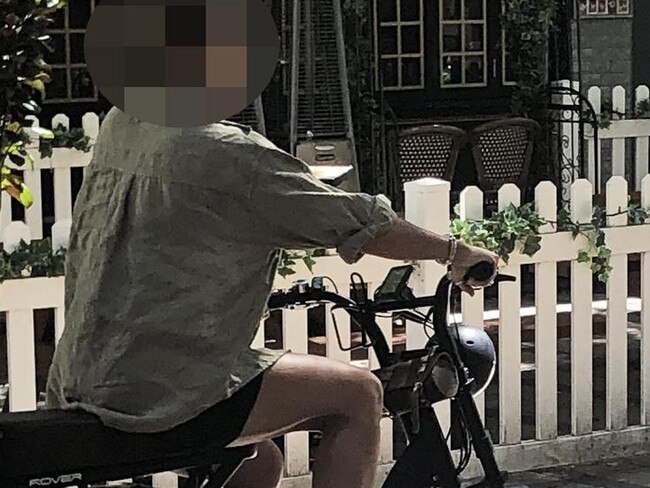 A woman, without a helmet, on an e-bike in the pedestrianised area of Sydney Rd, Manly. Picture: Jim O'Rourke