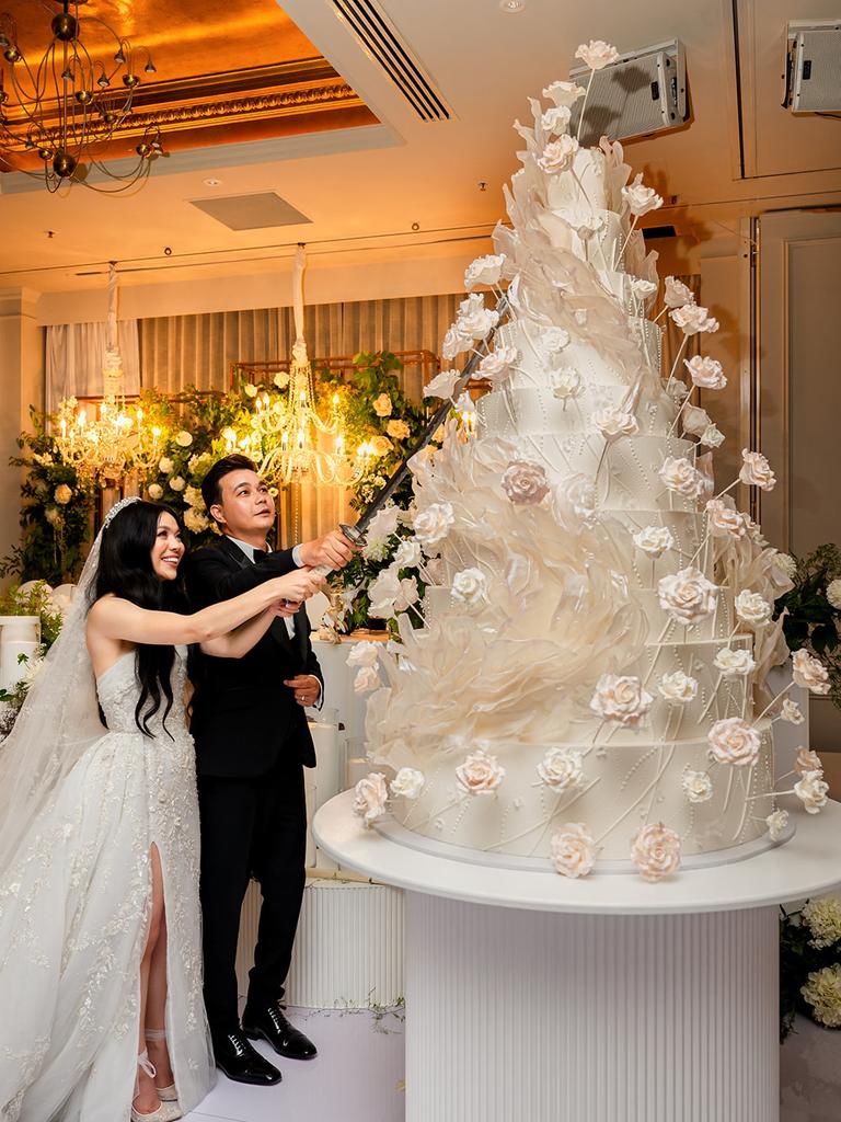 The couple’s 10-tier wedding cake was the star of the show. Picture: B Captured by Ky Luu