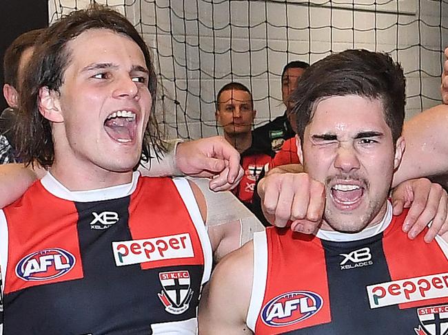 (L-R) Hunter Clark, Jade Gresham, Paddy McCartin and Tim Membrey of the Saints sing the club song after winning the Round 15 AFL match between the Melbourne Demons and the St Kilda Saints at the MCG in Melbourne, Sunday, July 1, 2018. (AAP Image/Julian Smith) NO ARCHIVING, EDITORIAL USE ONLY