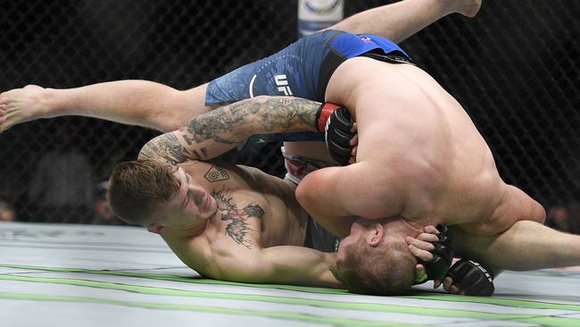 Sam Alvey and Jimmy Crute fight during their light heavyweight bout. Picture: AP Photo/Andy Brownbill