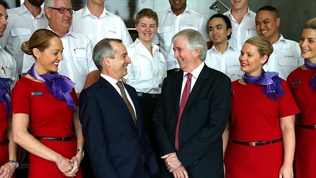 Virgin Australia CEO John Borghetti, outgoing chairman Neil Chatfield and Virgin staff after the company’s AGM in Brisbane yesterday. Picture: Peter Wallis