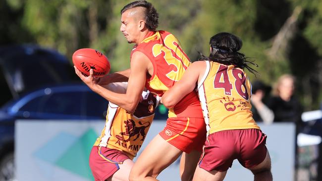 New Gold Coast Sun Joel Jeffrey gets a handball away in a VFL NAB League game. Picture: Scott Powick