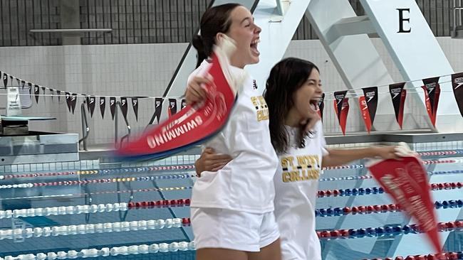 St Rita's captains Jemima Irvine and Sienna Bressington leap for joy.