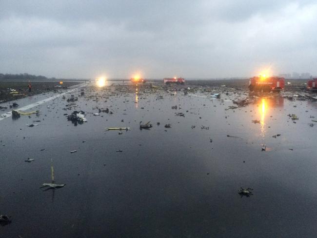 Russian emergency fire trucks are seen among the wreckage. (vk.com/rostovnadonu group via AP)