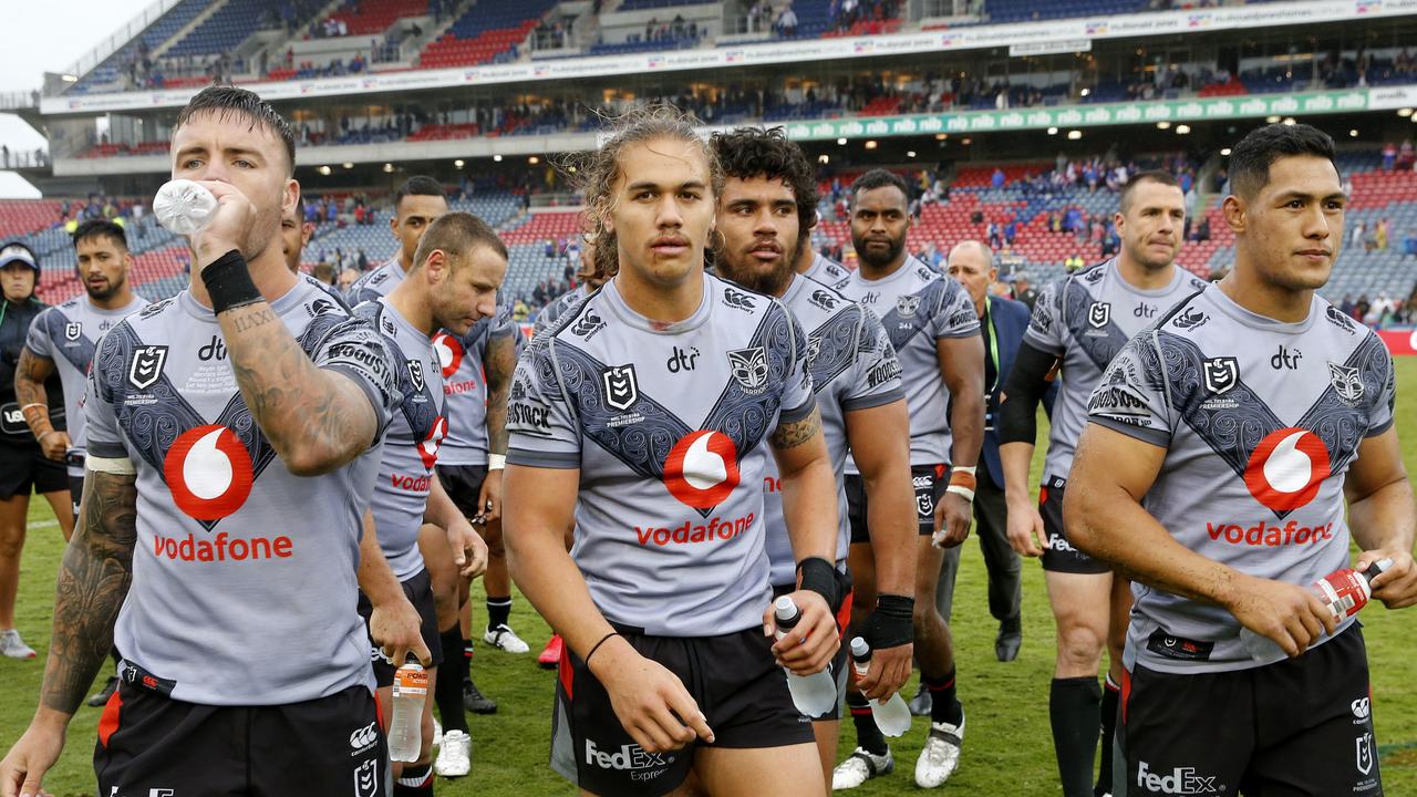 Warriors players leave the field after the Round One NRL match between Newcastle Knights and New Zealand Warriors