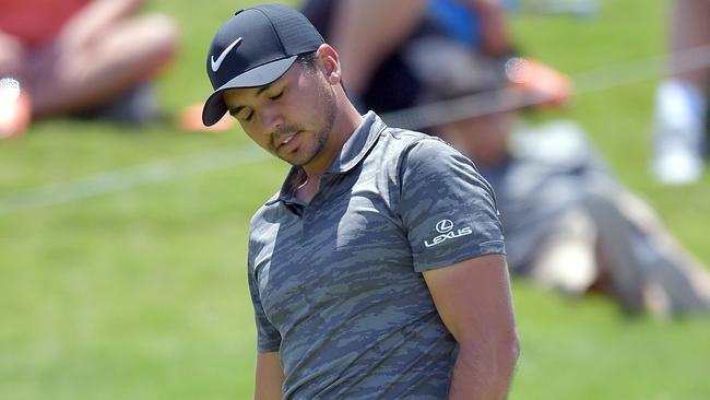 Jason Day of Australia reacts to a putt.