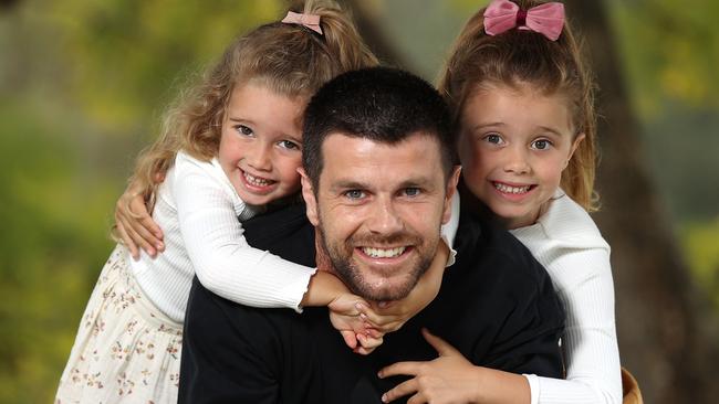 Richmond skipper Trent Cotchin with his daughters Harper and Mackenzie. Pic: Michael Klein