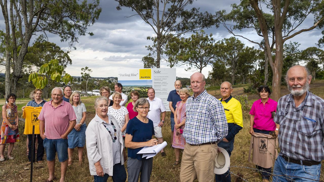 Darling Heights residents and concerned citizens including (centre, with petition) Paddy Flemming gather to protest what they say is a lack of consultation about a subdivision development in Frew St, concerns also relate to an increase in traffic and the removal of natural corridor for native animals, Monday, January 23, 2023. Picture: Kevin Farmer