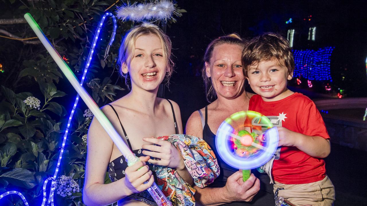 At Toowoomba's Christmas Wonderland annual Christmas lights display are (from left) Kayla Thomas, Adele Judd and Hunter Kennedy in Queens Park, Saturday, December 2, 2023. Picture: Kevin Farmer