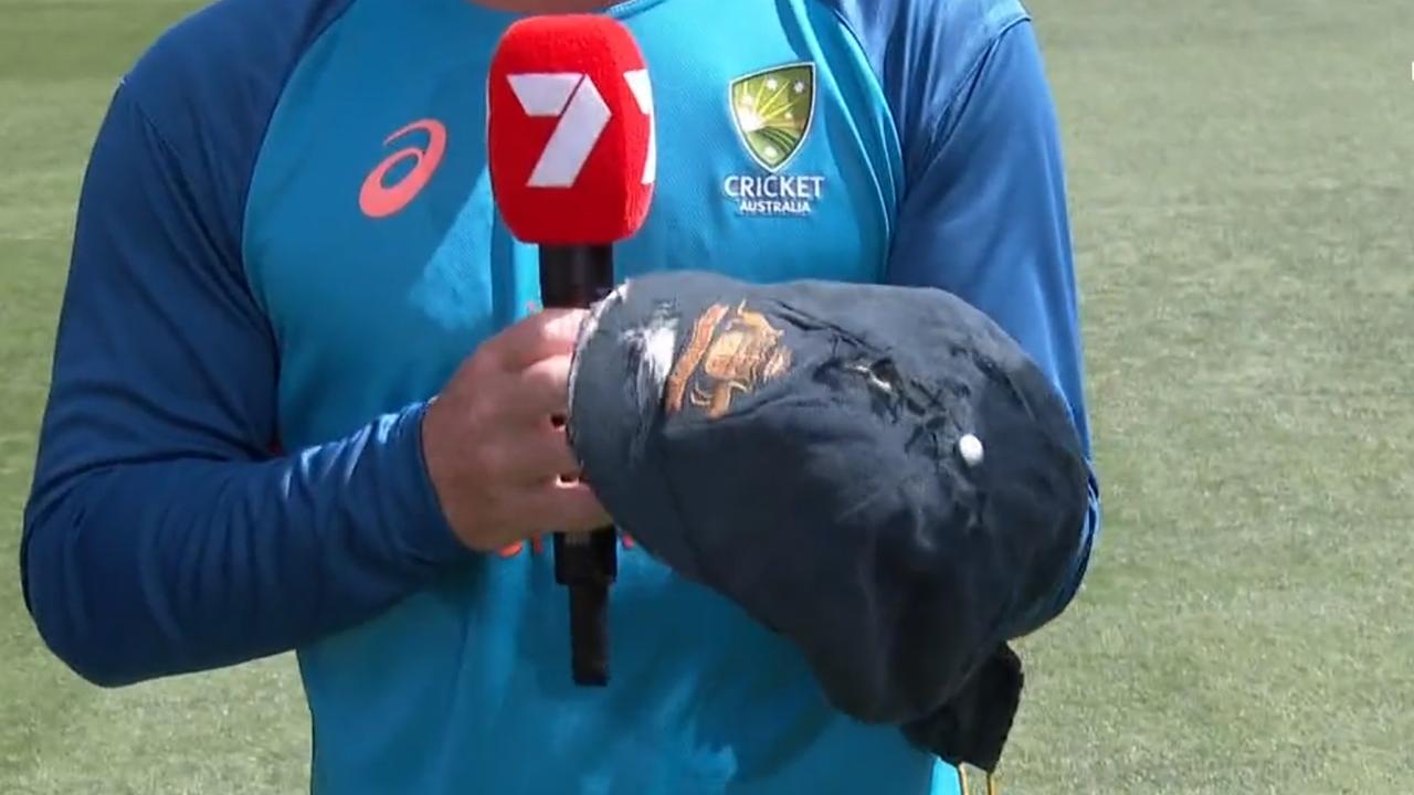 David Warner shows his Baggy Green on Channel 7. Photo: Twitter, @7Cricket.