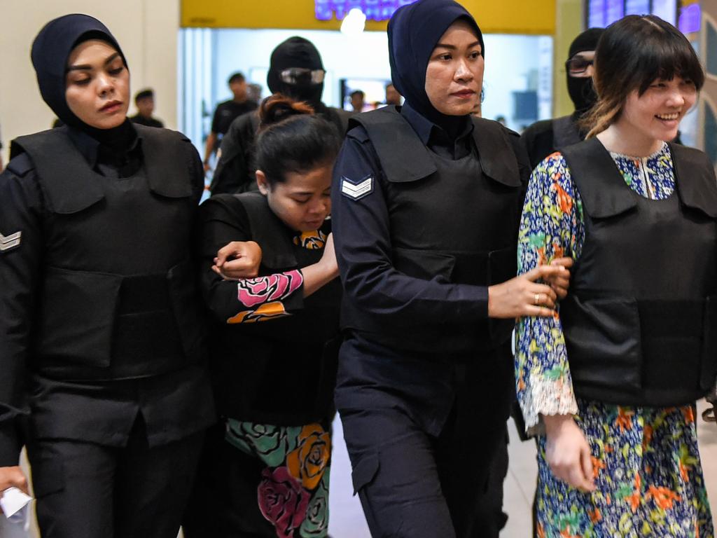 Doan Thi Huong (R) and Indonesian defendant Siti Aishah (2nd, L) arrive at court in October, 2017. Picture: AFP
