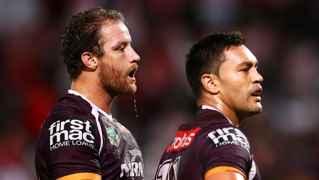 Korbin Sims and Alex Glenn of the Broncos looks dejected.