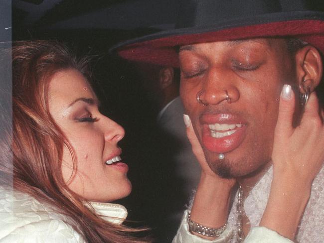 373750 01: 2/26/99 Beverly Hills, CA. New Laker Dennis Rodman celebrates his first winning game out on the town at GOODBAR with wife Carmen Electra.