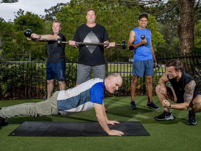 Legendaddys is a group of Gold Coast fathers who are working together to lose weight and become better dads in the process. Brett Crawford, Doug Kirby, Paul Mulder (on the ground), Rishi Dadhe and trainer Mitchell Lowe at SNAP Fitness. Picture: Jerad Williams