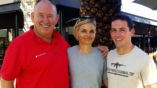 Former police officer and Cross of Valour recipient Allan Sparkes with NT Police officers Kristen Jamieson and Zachary Rolfe.