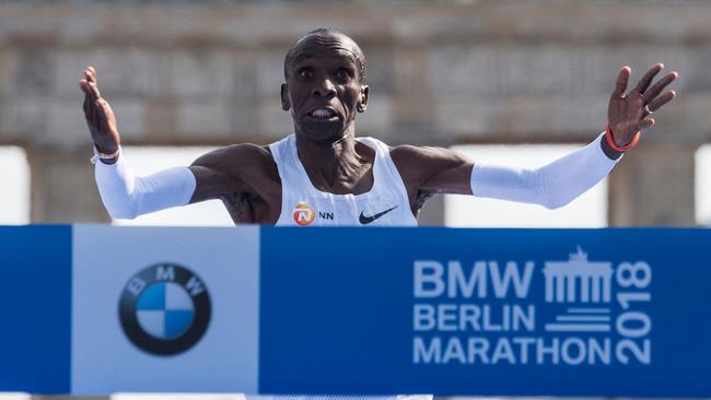 Kenya's Eliud Kipchoge crosses the finish line to win the Berlin Marathon setting a new world record on September 16, 2018 in Berlin. (Photo by John MACDOUGALL / AFP)