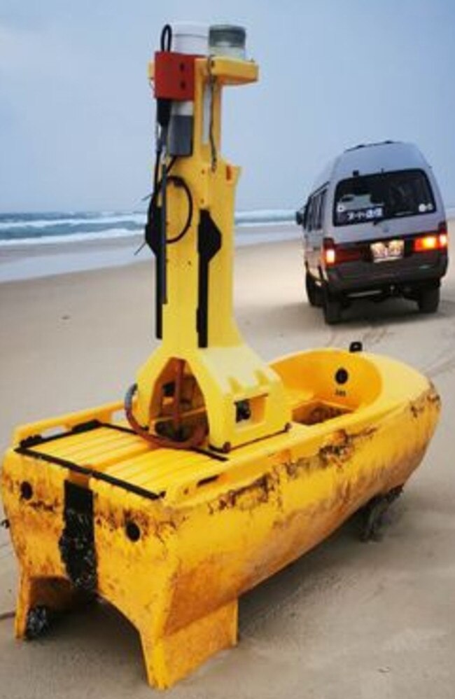 A mystery yellow object has washed up on Teewah Beach with speculation rife online as to its use. Picture: Geoff Feeley