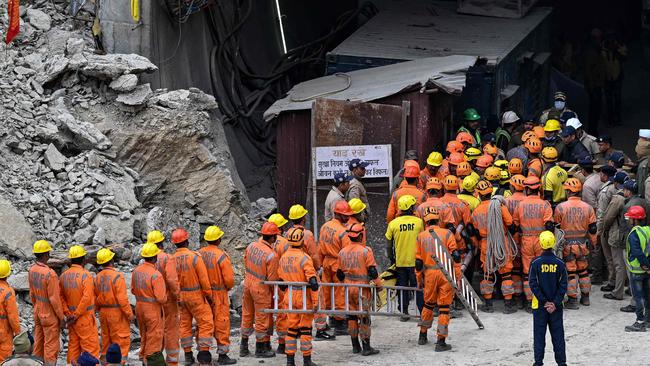 National Disaster Response Force (NDRF) personnel head inside the tunnel. Picture: Sajjad Hussain /AFP