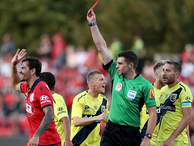 Adelaide United defender Ersan Gulum receives his marching orders from referee Shaun Evans. Picture: AAP Image/James Eslby