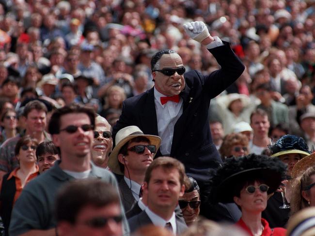 A man wears a Richard Nixon mask in 1996.