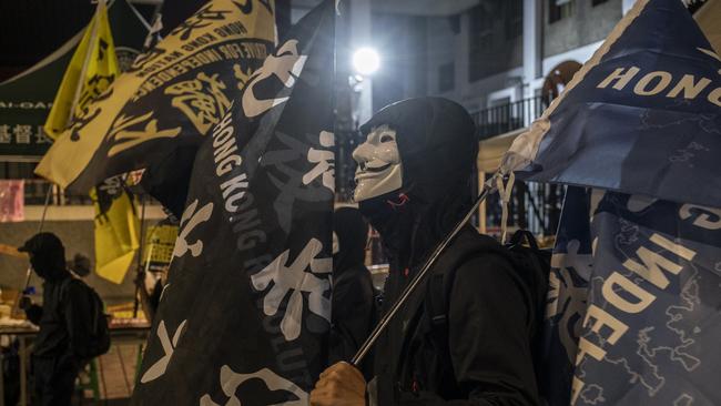 Demonstrators hold the flags of Free Hong Kong - Revolution Now during an anti-China protest on Friday in Taipei. Picture: Getty Images