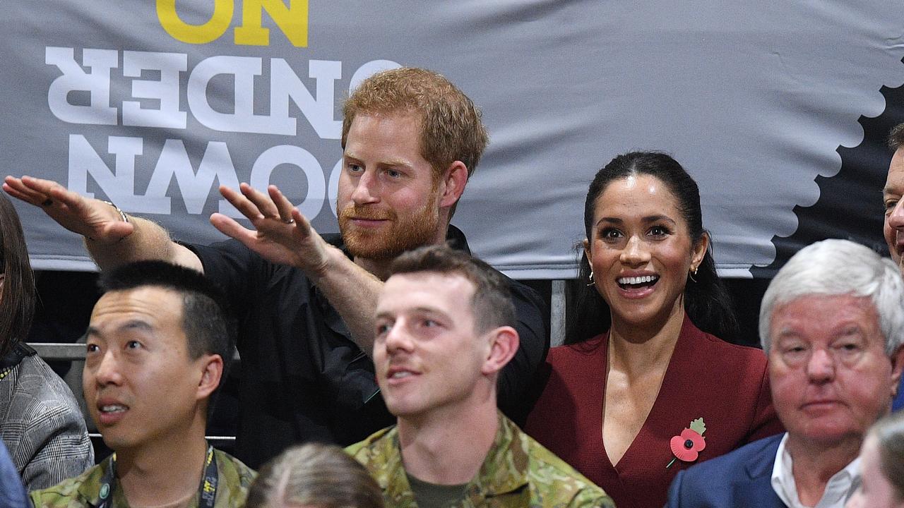 Harry and Meghan got into the spirit of the game. Picture: Image/Dan Himbrechts