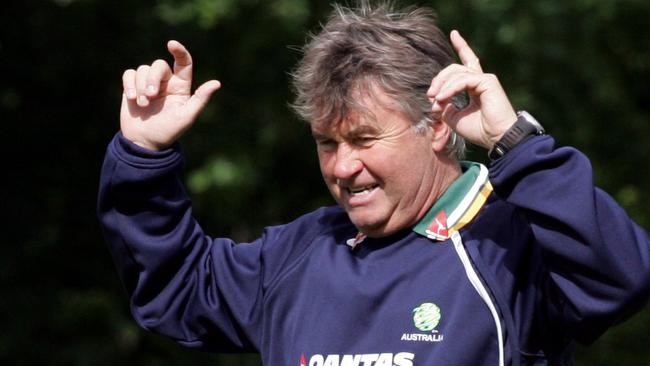 Socceroos coach Guus Hiddink celebrates after he hit crossbar in competition with other coaches for a bottle of wine during Australia team World Cup 2006 training session while in camp in Mierlo, The Netherlands, 29/05/06, before heading off for finals in Germany.