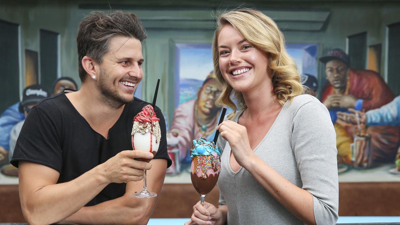 Pete Haselhurst and Natalie Bascur with a Wagon Wheel and Bubble 'O Bill cocktails at Milky Lane, in Bondi. Picture: Justin Lloyd.